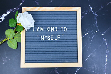 Grey letter board with phrase Self care, I am kind to myself. Self love, Mindfulness lifestyle,...
