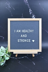 Grey letter board with phrase Self care, I am healthy and strong. Self love, Mindfulness lifestyle,...
