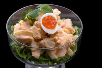 Savory squid dish with quail eggs, red caviar, and sauce