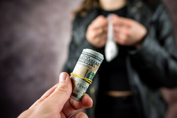 addict woman with us money bills buying in drug dealer cocaine or heroine