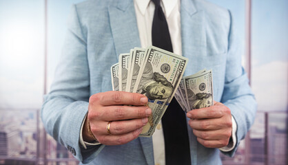 business man accounting stack of dollar money