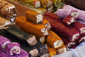 Various Turkish sweets with cream filling on sale at the market.