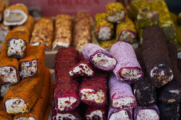 Various Turkish sweets with cream filling on sale at the market.