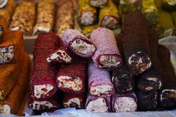 Various Turkish sweets with cream filling on sale at the market.