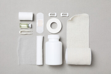 First aid kit supplies on gray background