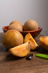 Sapodilla fruit (Manilkara zapota) and other names such as sapota, chikoo, chico, naseberry, or nispero. Sapodilla is tropical fruit evergreen tree and sweet taste fruit