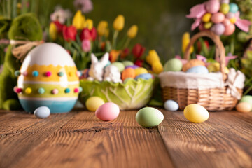 Fototapeta na wymiar Easter theme. Easter decorations. Easter eggs in basket and easter bunny. Bouquet of spring flowers. Rustic wooden brown table.