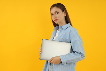 Fototapeta premium Concept of people, young woman on yellow background