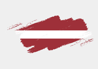 Artistic grunge brush flag of Latvia isolated on white background. Elegant texture of national country flag