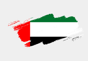 Artistic grunge brush flag of United Arab Emirates isolated on white background. Elegant texture of national country flag