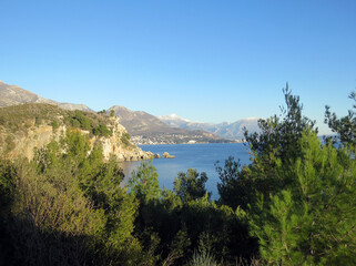 Fototapeta na wymiar View at Sutomore in Montenegro from a natural setting with blue sky and sea