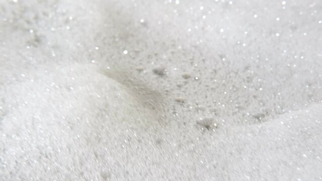 Foam bubble from soap or shampoo top view. Soap foam texture surface for white abstract background. Detergent foam. Copy space, banner. For laundry, cleaning service. Bathroom, clean, wash concept