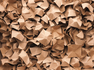Eco friendly packaging material made of recycled waste paper to protect the goods against damage using as background or header, reuse materials, environmental protection