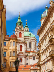 View of Prague historical center with Church of Saint Nicholas beautiful baroque dome and clock tower