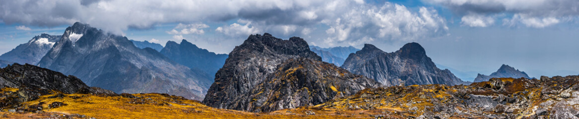 Wide panoramic view of the Rwenzori Mountains, Uganda. Weismanns peak summit in cloudy day.