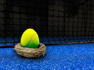 Padel easter egg ball on court