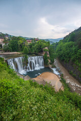 Obraz premium Jajce got its name from the large and small egg-like hills around it and draws attention with its steep-roofed typical houses and waterfall.