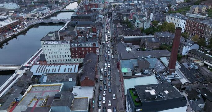 Heavy Traffic In The Early Morning In Cork City With River Lee In Ireland. - aerial