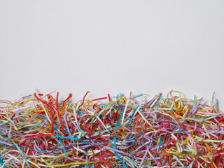  Colored shredded papers and white copy space