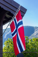 Norwegian National Flag Hanging On Poles Outside A Building