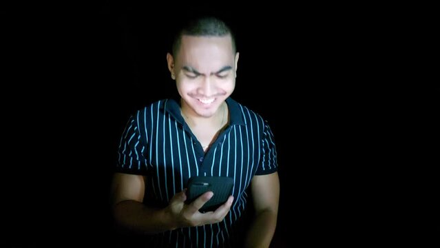 handsome young filipino man with phone