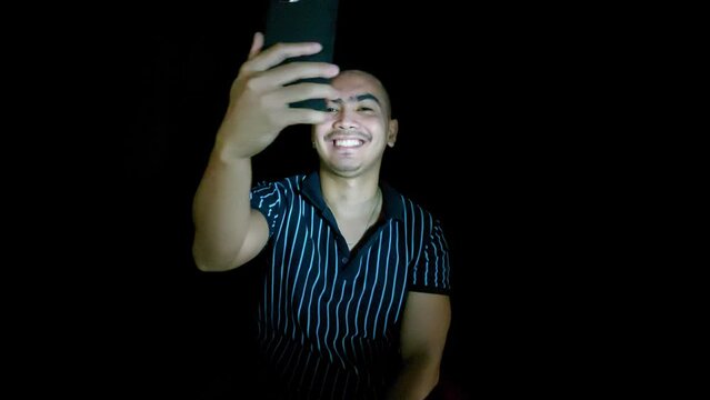 handsome young filipino man with phone