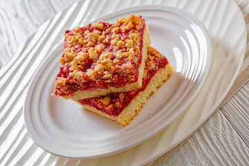 Raspberry Crumble Bars on white plate, top view