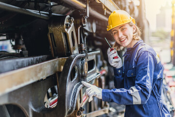 Engineer woman worker work in Diesel Locomotive Repair Shops Happy smiling