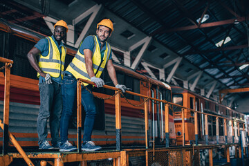 Engineer mechanic team workers standing relax in Diesel Locomotive Repair Shops