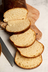 Homemade square sandwich sourdough loaf bread cut in slices, top view.