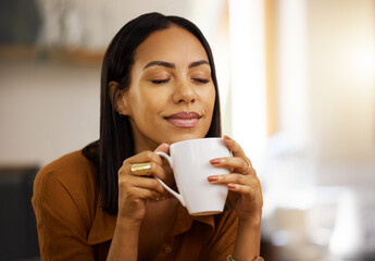 Happy smile, coffee and woman at home in a kitchen with a hot drink feeling relax and calm in the morning. Happiness, zen and young female in a house holding tea and mug in a household with mockup