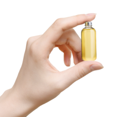 Woman's hand hold Bottle of essential oil isolated on white background