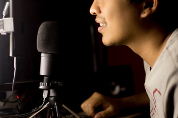 Close-up focus microphone for studio recording, radio station for program and wave control.