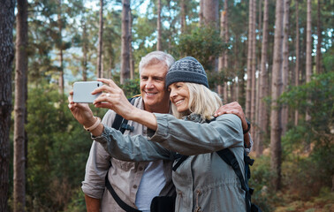 Selfie, forest and hiking, old couple on nature walk taking picture for retirement vacation in Peru. Travel, senior man and mature woman with phone on hike with love and health on holiday adventure.