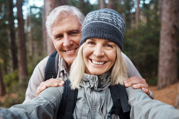 Senior couple, selfie and portrait, hiking in forest and happy people in nature and memory for social media post. Smile in picture, adventure and fitness outdoor, man and woman with active lifestyle