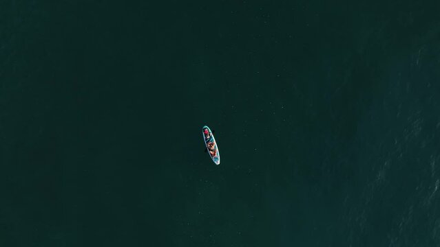 Professional drone shooting of people on sup boards in Indian Ocean