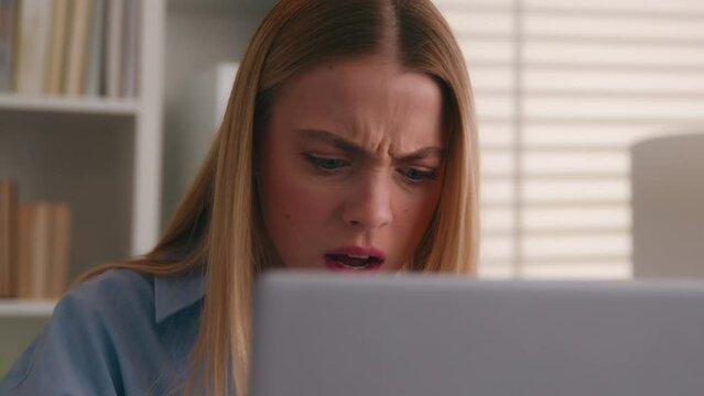 Close up angry upset Caucasian woman user using laptop in home office frustrated mad confused shocked computer problem say what shock failure online stressed girl businesswoman mistake software error