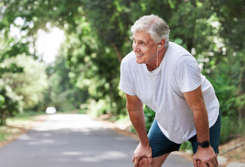 Senior man, outdoor and rest with music earphones for run, workout and training on road for fitness. Elderly male person happy and tired of cardio for health and wellness with audio for running