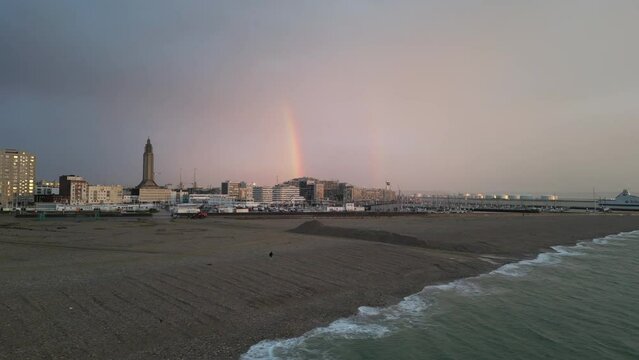 Rainbow over the beach and the port of Le Havre drone view