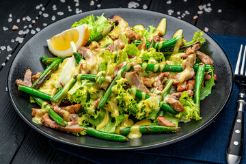 Grilled meat salad with green beans and mustard sauce.