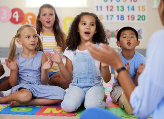 Teacher, singing or kids in classroom learning a song together in preschool for voice development....