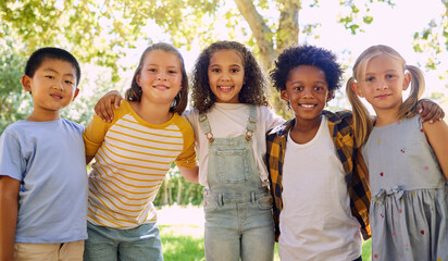 Portrait, kids and a group of friends standing in a line together outdoor, feeling happy while having fun. Diversity, school and smile with children in a row, posing arm around outside in a park