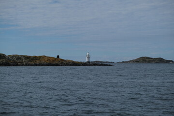 Fototapeta premium Small lighthouse on a rocky island in Sweden