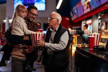 Multigenerational family at movies.