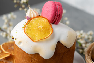 Beautiful Easter cake decorated with macarons cookie and dry orange piece