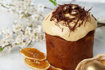Easter cake and golden eggs on table