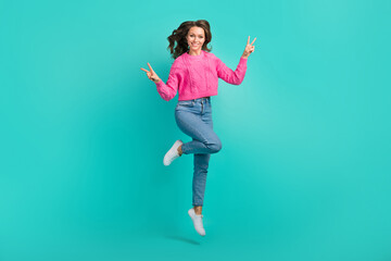 Fototapeta na wymiar Full length photo of overjoyed cute girl wear stylish outfit have fun hand demonstrate v-sigh cool party isolated on cyan color background
