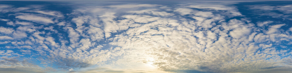Panorama of a dark blue sunset sky with golden Cumulus clouds. Seamless hdr 360 panorama in spherical equiangular format. Full zenith for 3D visualization, sky replacement for aerial drone panoramas.