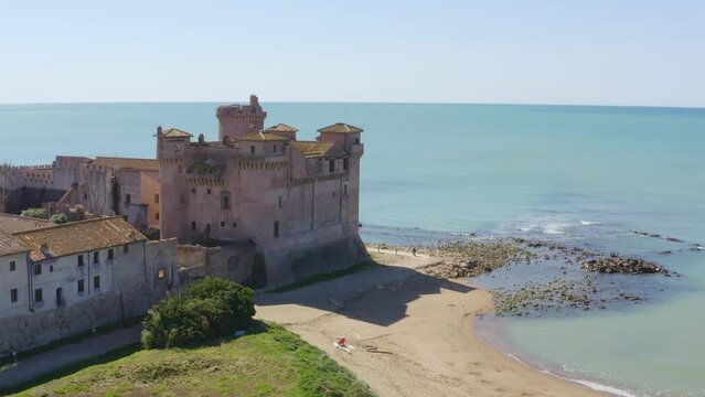 Aerial view of the Castle of Santa Severa, located in Santa Marinella in Lazio, in the Metropolitan City of Rome, Italy. It is a medieval castle built on the beach and overlooking the Tyrrhenian Sea.
