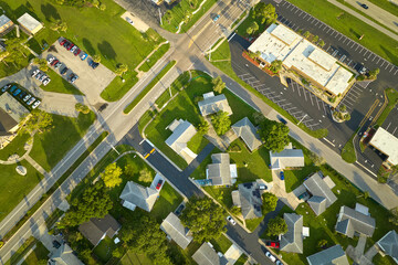 Aerial view of small town America suburban landscape with private homes between green palm trees in Florida quiet residential area